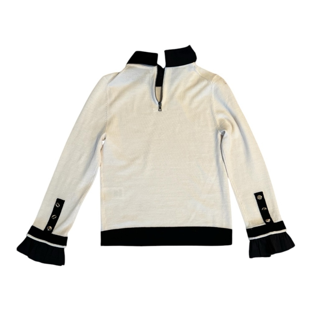 White and black Alice + Olivia XS long sleeve top with ruffled collar and cuffs